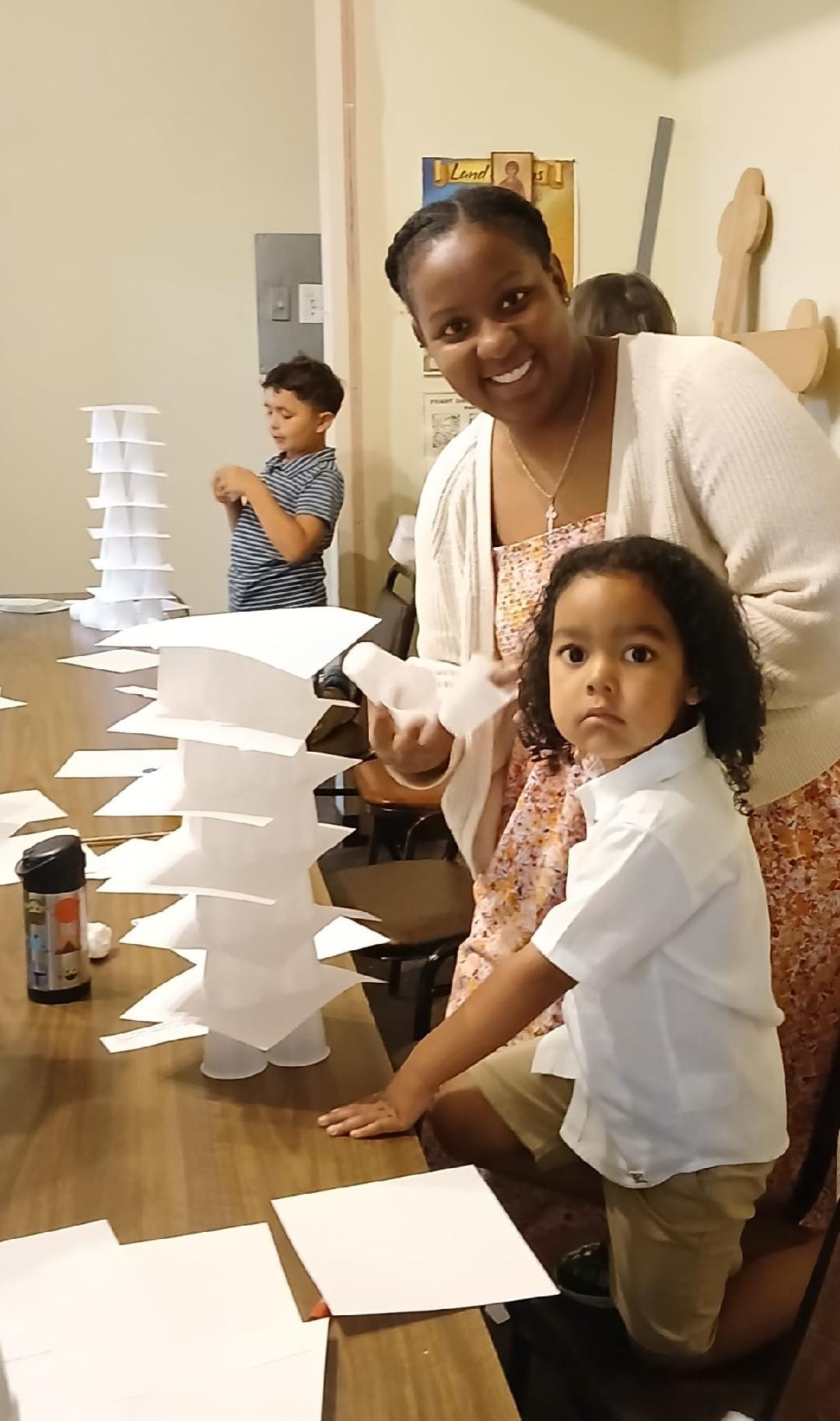 Parent and child working together on their Tower of Babel